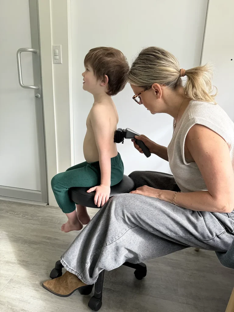 Child receiving treatment from adult.
